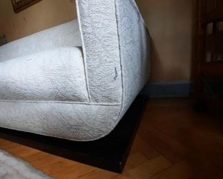 The sofa arm (detail) with wooden base plinth. MID CENTURY CUSTOM MADE IN NYC