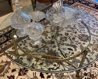Glass top coffee table with brass base