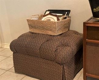 One of two upholstered ottomans; one of several organizing baskets