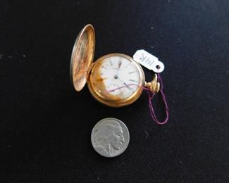 14K pocket watch. There is some water damage to the face from a fire.