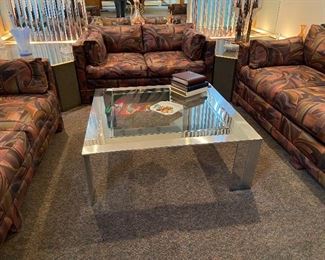 Living Room with custom covered Sofas, Chrome and Glass Coffee Table