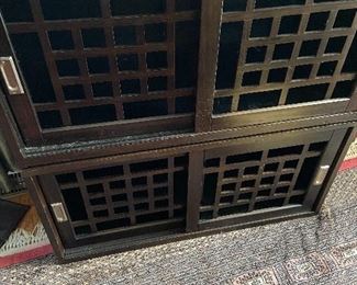 Stackingstorage with Lattice doors, there are 3