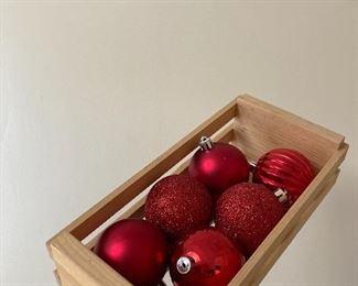 Red ornaments in crate $15