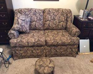 Lovely, comfy and neutral color Love Seat that will add a great look and extra seating to any area of your home.  Has matching footstool and pillow and is SO comfortable!