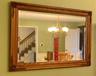Wall mirror, oak with detailing.

Also, please note the red cool thing in the room.   It never lived in this room before and need to be in your much cooler house.