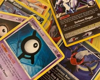 Pokémon cards, including some rare (-ish) cards, including holograms and shiny cards.      