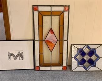 Stained glass panels (unframed).
Some minor cracking in the amber one, blue one is great.

That other picture is of zebras.    Probably not going to be the same customer buying all three LOL