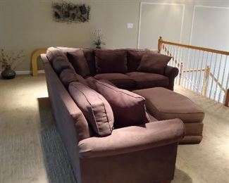 Sectional measures 87" x 115" - it is 32 1/2" deep and 32" to the top of the pillows