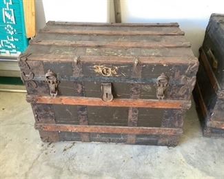 Three wonderful old trunks two flat and one domed