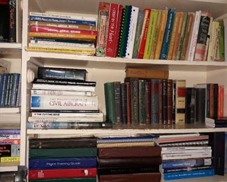 Cookbooks, aircraft flight training manuals, flying themed books, and vintage textbooks. 
