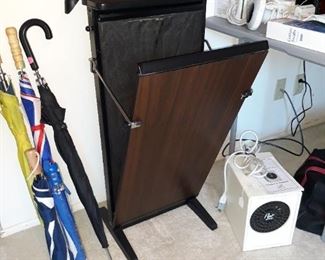 Vintage trouser press, umbrellas, and air purifer.