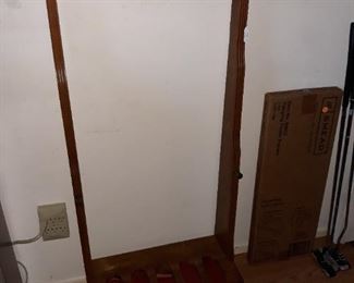 Vintage gun rack with ammunition drawer.