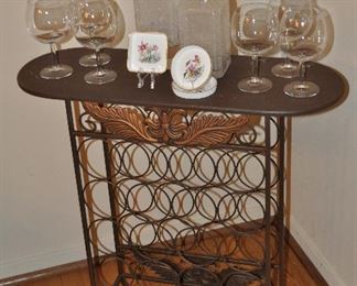 16 Bottle Bronze Metal Wine Rack and Side Table, 27.5" x 28.5"h x 10"d Shown with a Set of 6 Wine Glasses and a Pair of Vintage Frosted Decanters