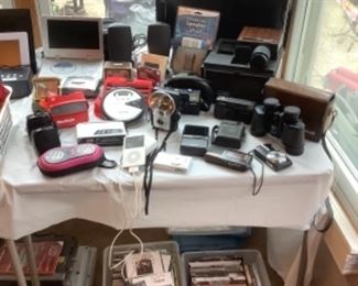 Assortment of old electronic equipment…old IPOD, camera, clocks etc