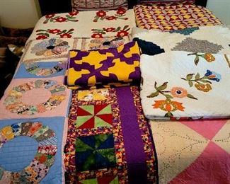 Large assortment of quilts