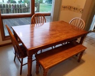 Oak Express table with 3 chairs and a bench seat