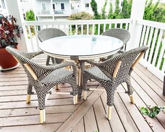 Outdoor glasstop table and  rattan chairs