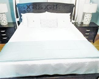 Master bedroom - King size four poster  bed - shows matching bedside tables and lamps