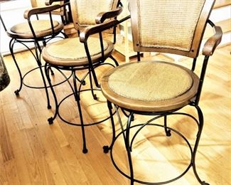 Three matching barstools - wood, wrought iron, and woven wicker