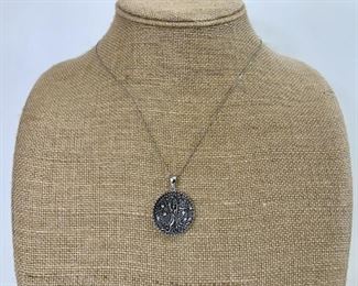 Sterling Silver Chain With Round Embossed Pendant
Lot #: 121