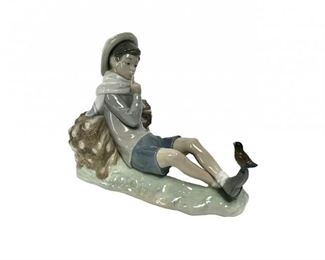 A Lladro Shepherd Boy With Bird Figurine
Lot #: 134