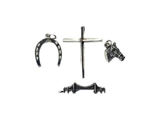 A Sterling Silver Horseshoe Charm Together With Three Other Charms
Lot #: 187