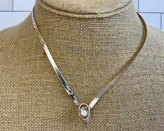 Sterling Silver Herringbone Chain With Faux Diamond Pendant
Lot #: 189