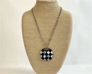 Sterling Silver Chain With Onyx And Mother Of Pearl Round Pendant
Lot #: 203