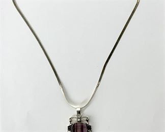 Amethyst Pendant Together With Sterling Silver Herringbone Chain
Lot #: 213