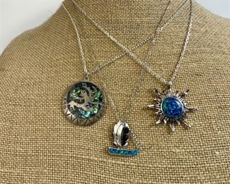Three Sterling Silver Chains With Opal Pendants
Lot #: 219
