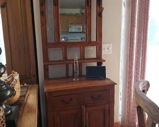 Small wooden cabinet with mirrors