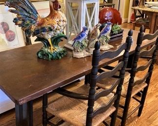 Harvest table; 2 black ladder back rush-seat arm chairs
