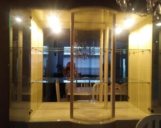 The glass china looking very elegant with the lights on.  It looks just as gorgeous with lights off.  It has 9 spacious shelves.