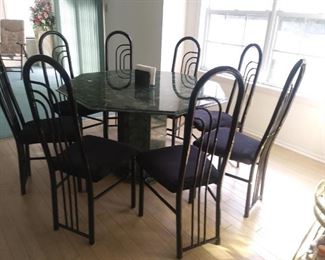 Green octagon Marble dining set which includes a marble napkin holder and 8 chairs.