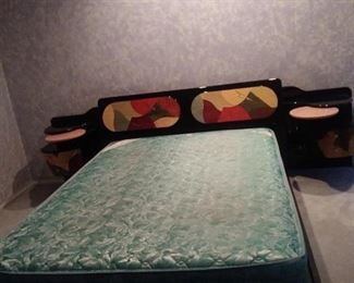 Gorgeous queen size bed with attached night stands.