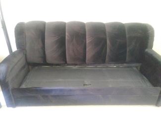 Sofa bed without the cushions before it opens into a bed.