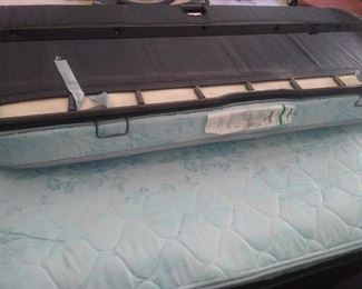 Pull the metal part to open the bed.