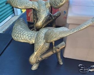 A pair of solid brass eagles, sold separately, the larger one has a wing span of over 30 inches and stands almost 2 feet high. Very good condition, see pictures for details