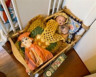 Vintage baby cradle and dolls