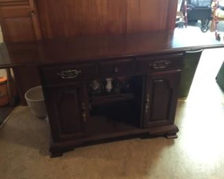Buffet - mahogany - has drawers, pull up shelves, storage on either side & display in middle