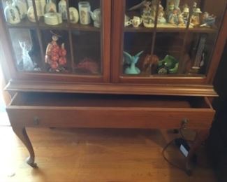 China cabinet full of collectibles