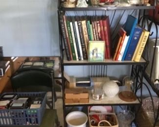 Books, collectibles, mirror, vintage office chair, and computer items