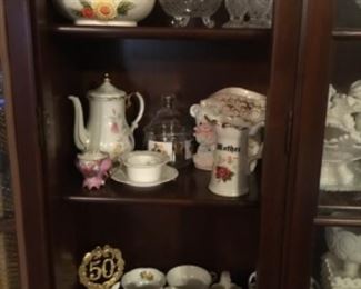 Items inside China cabinet in kitchen