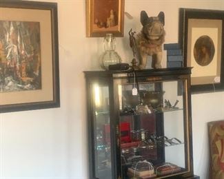 Chinese display cabinet and a few of the many paintings in the house.  