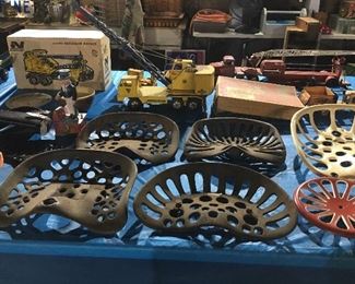 Cast iron tractor seats, old toys including Tonka, Nylint & others.  