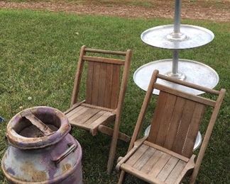 Wooden chairs, aluminum display piece, horse head painted cream can.  