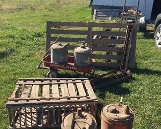 Oil & gas cans, chicken crate, wood gate, radio flyer wagon, wooden ladders.  