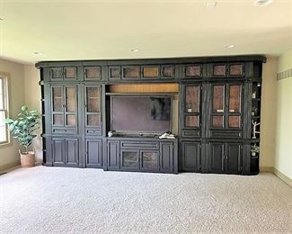 Beautiful classic dark wood wall media cabinet with bookshelves.