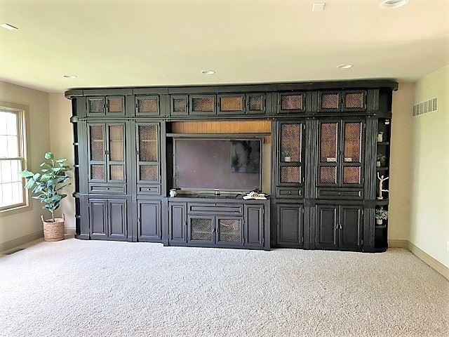 Beautiful classic dark wood wall media cabinet with bookshelves.