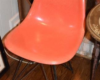 Mid century orange fiberglass chair on  metal legs - 1960’s - Eames style